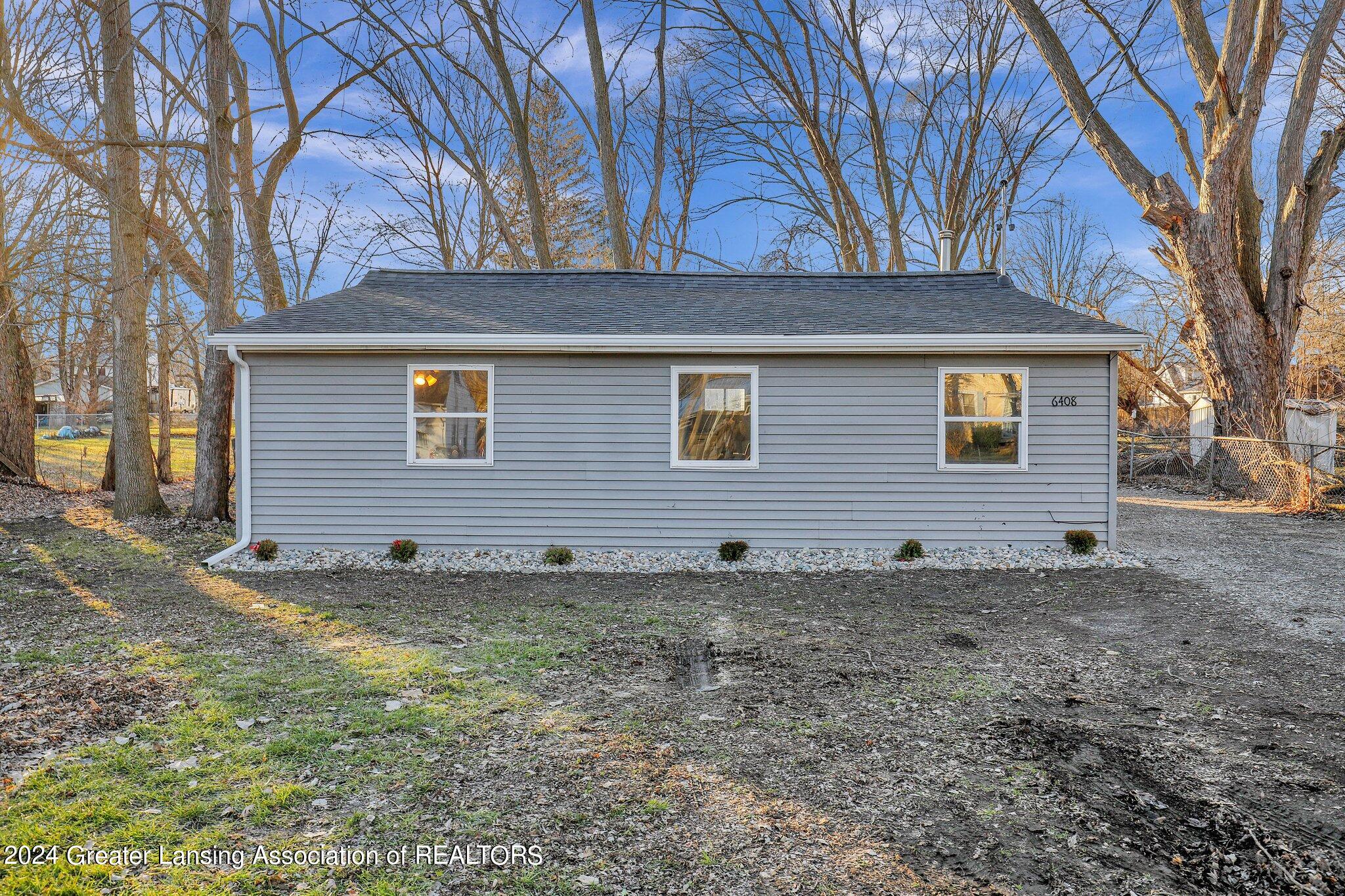 6408 Cooper Road Lansing, MI 48911 - Photo 1 of 19 Front
