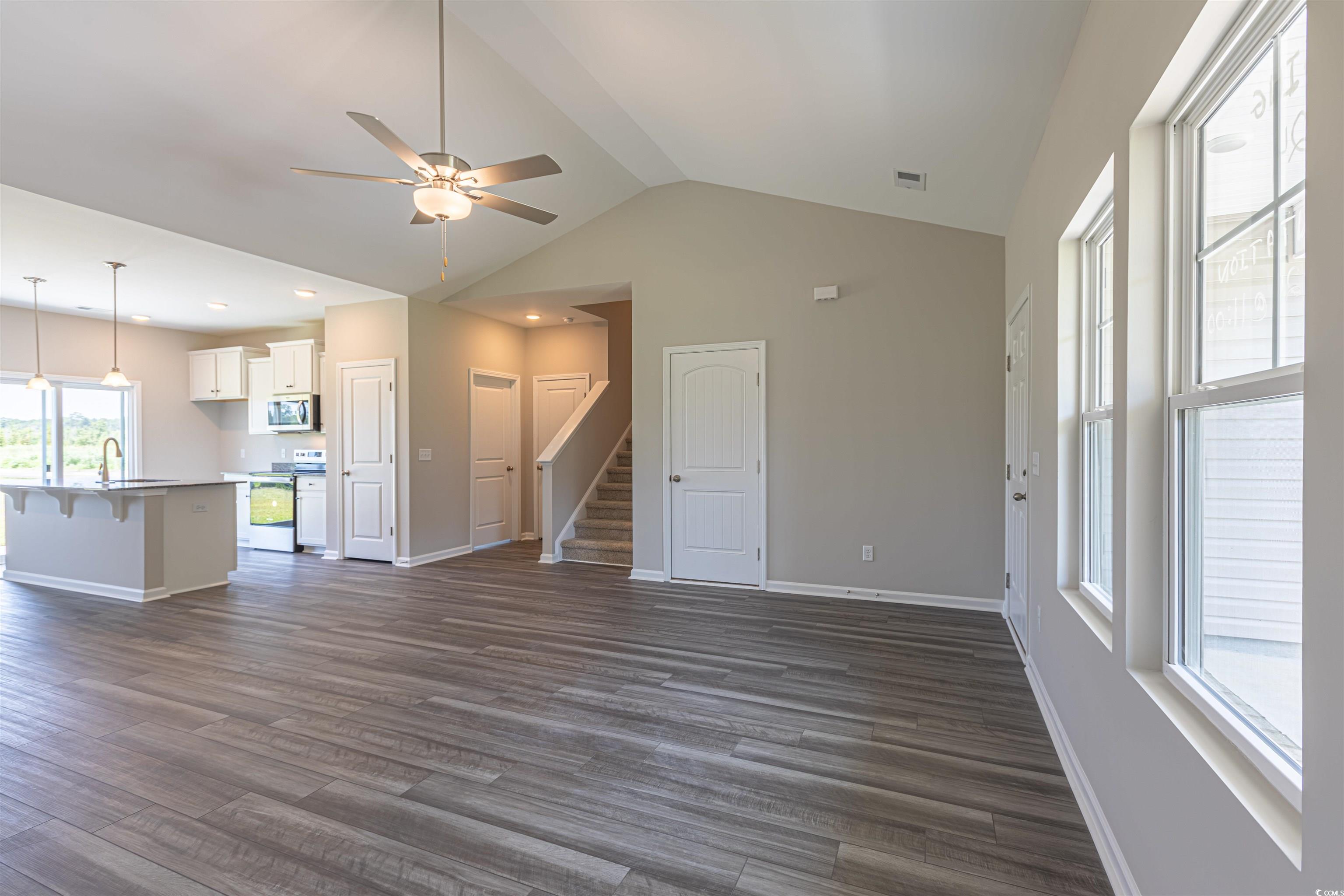 7064 Shady Grove Road Conway, SC 29527 - Photo 10 of 14 Unfurnished living room featuring ceiling fan, dar