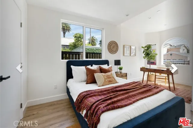 a workspace with furniture and a potted plant