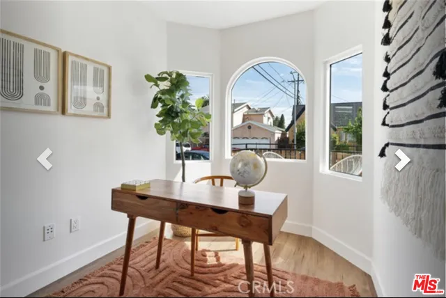 a bed room with a bed and a chair