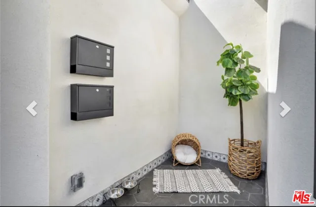 a table with a vase and flowers on it