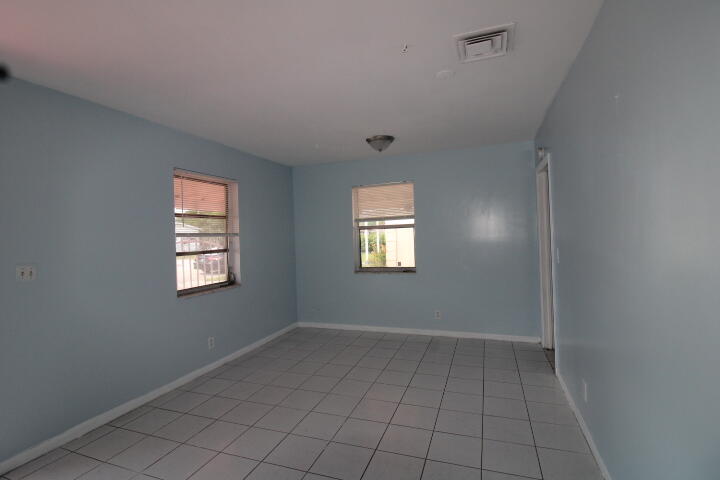 578 West 2nd Street Riviera Beach, FL 33404 - Photo 13 of 15 an empty room with windows