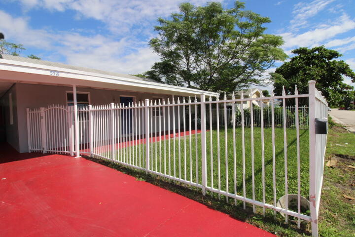 578 West 2nd Street Riviera Beach, FL 33404 - Photo 2 of 15 a view of a backyard with a small plants