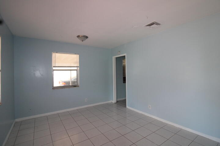 578 West 2nd Street Riviera Beach, FL 33404 - Photo 5 of 15 a view of an empty room with window