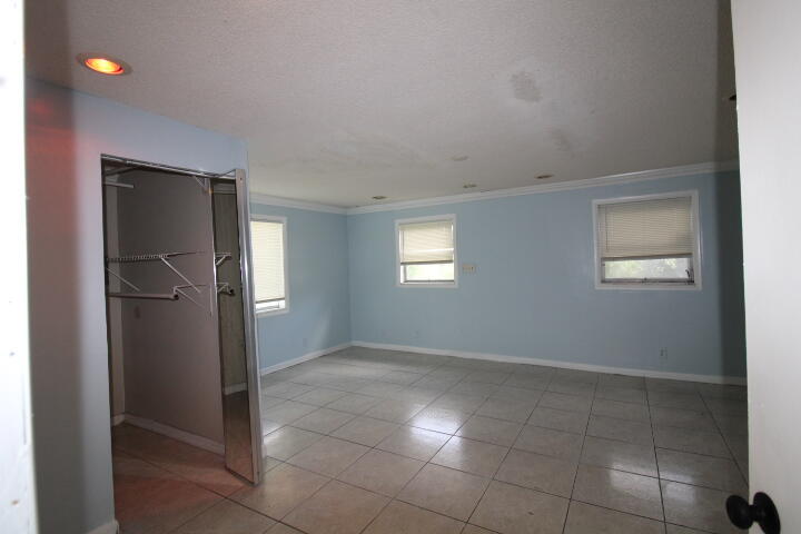 578 West 2nd Street Riviera Beach, FL 33404 - Photo 8 of 15 a view of an empty room with a window