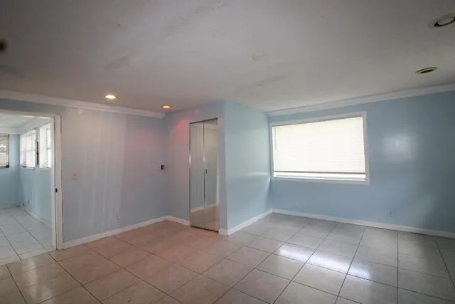 a view of an empty room and window