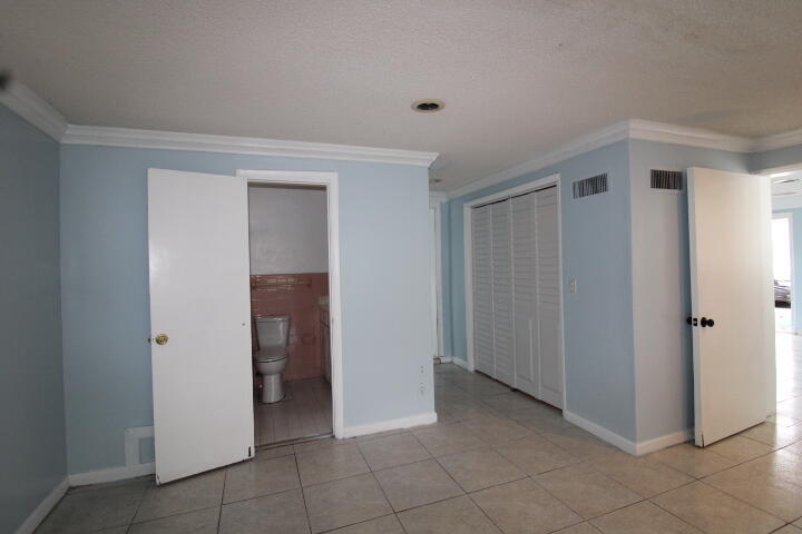 578 West 2nd Street Riviera Beach, FL 33404 - Photo 10 of 15 a view of an empty room and closet area