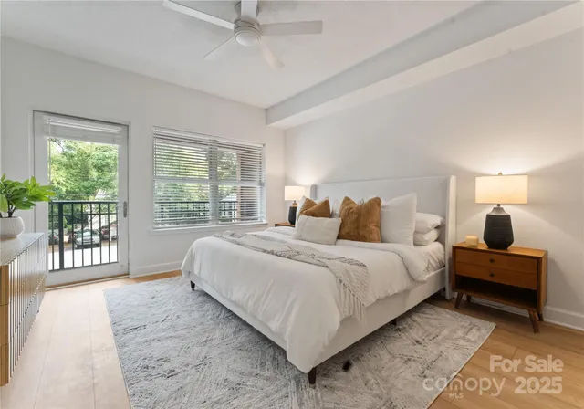 a bedroom with bed and a large window