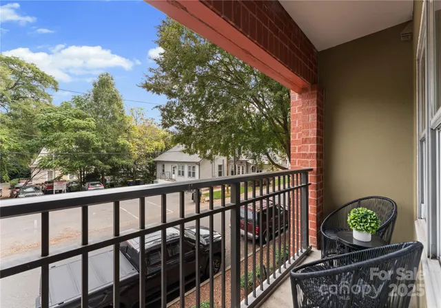 a view of balcony with wooden floor