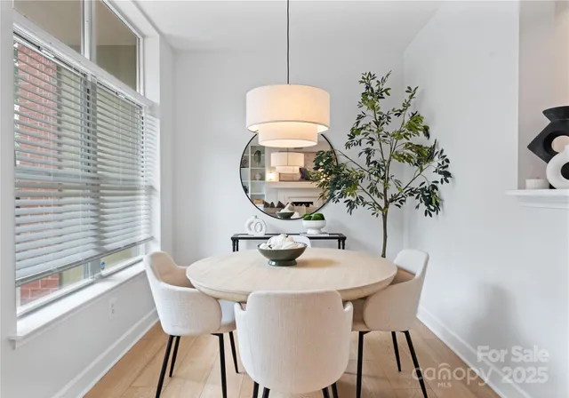 a dining room with furniture and window