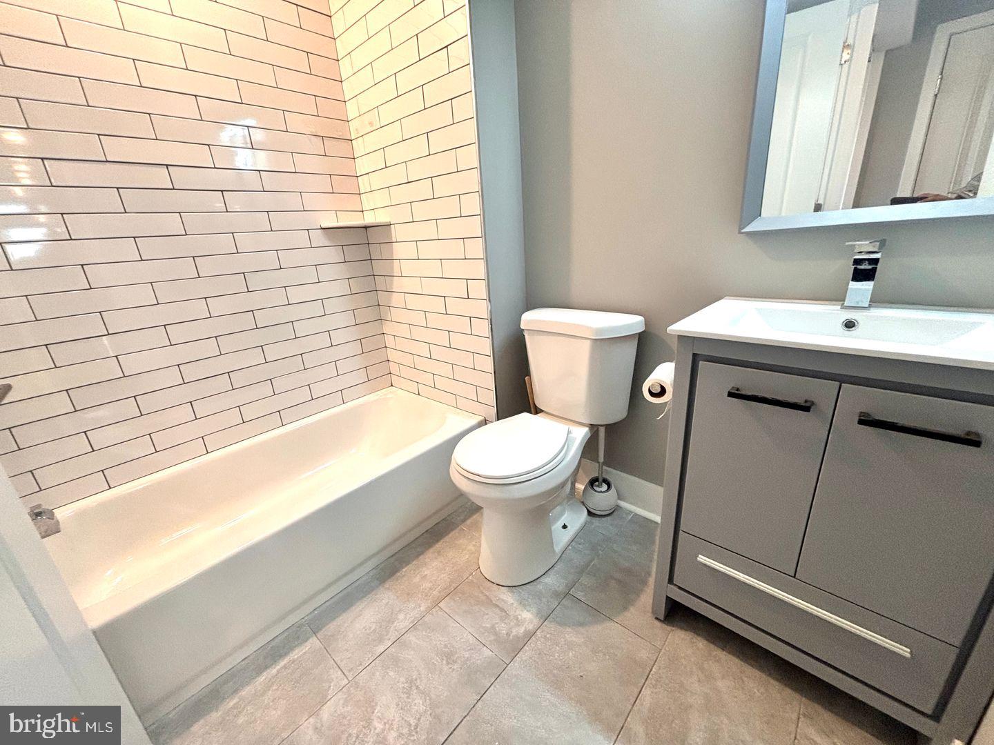3255 Ridge Avenue Philadelphia, PA 19132 - Photo 14 of 28 a bathroom with a sink toilet and shower