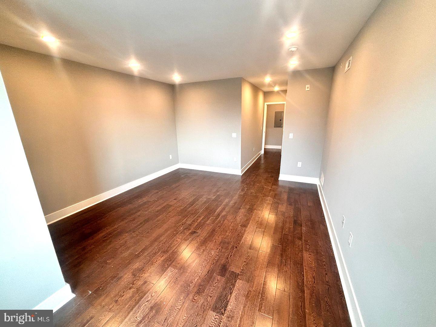 3255 Ridge Avenue Philadelphia, PA 19132 - Photo 16 of 28 a view of a hallway with wooden floor