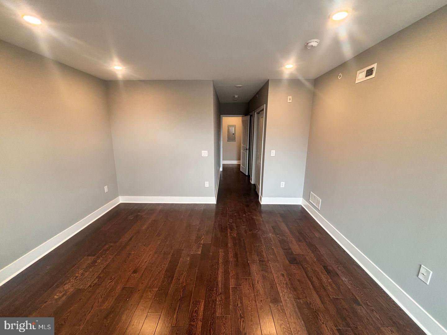 3255 Ridge Avenue Philadelphia, PA 19132 - Photo 17 of 28 a view of an empty room with wooden floor and closet