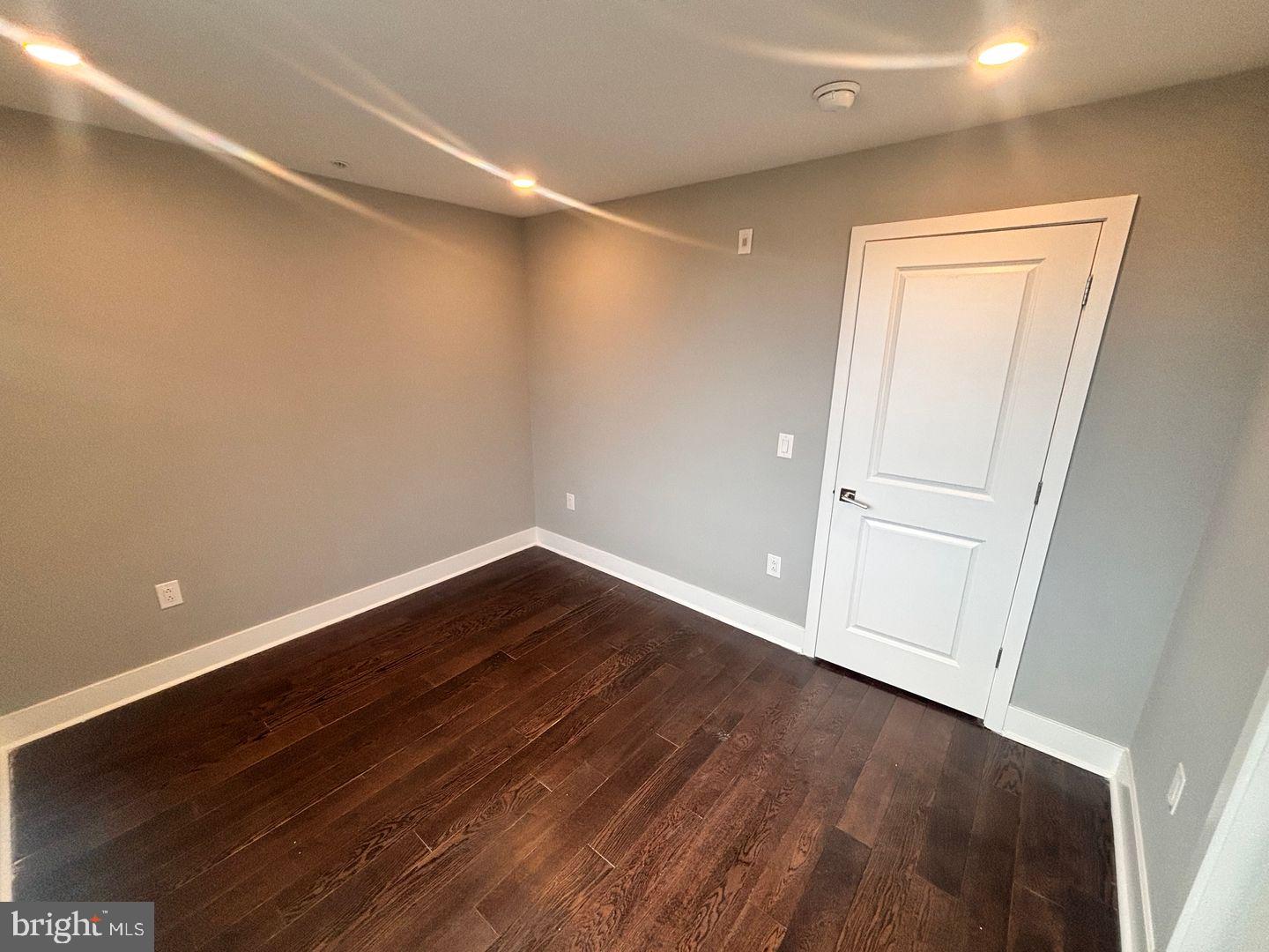 3255 Ridge Avenue Philadelphia, PA 19132 - Photo 8 of 28 a view of an empty room with wooden floor