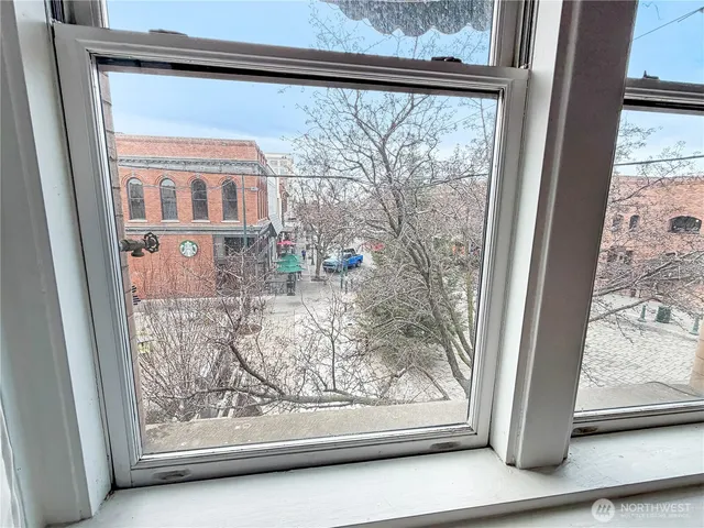 a view of a balcony with chair and table