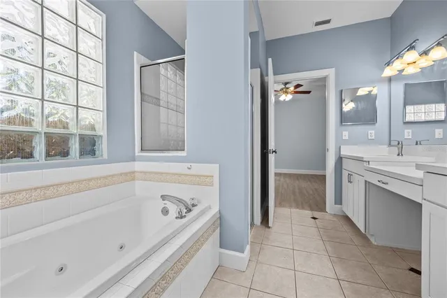 a view of empty room with wooden floor and fireplace