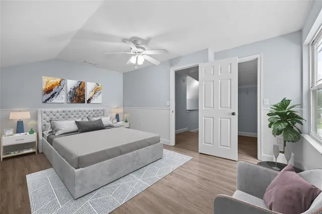 a view of a backyard with wooden fence and a bench