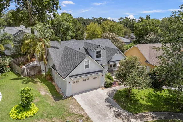 a view of a house with yard and a garage