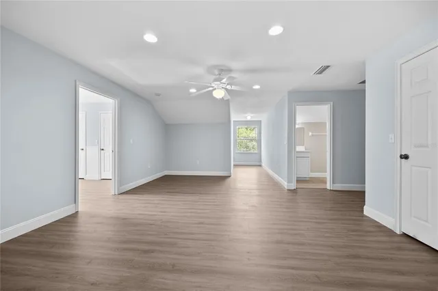 an aerial view of a house with swimming pool and garden