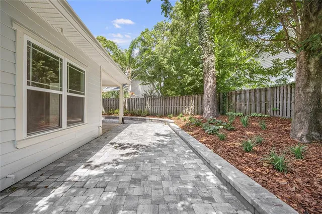 an aerial view of a house with a swimming pool