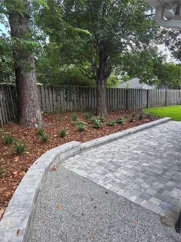 an aerial view of residential house with outdoor space and swimming pool
