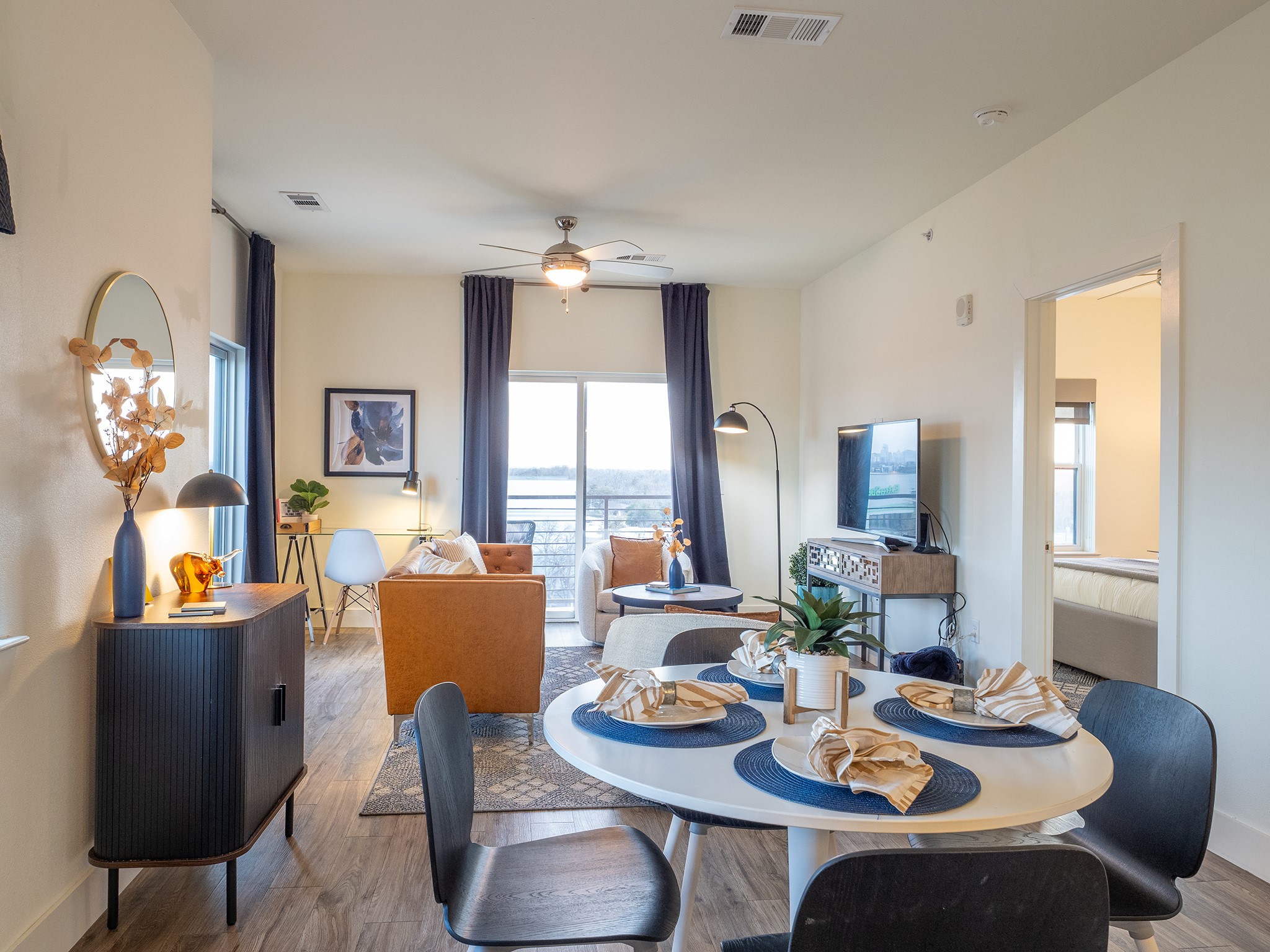 6444 Burnet Road, Unit 509 Austin, TX 78757 - Photo 9 of 32 An open-concept layout connects dining and living areas, offering a seamless flow to the outdoors.