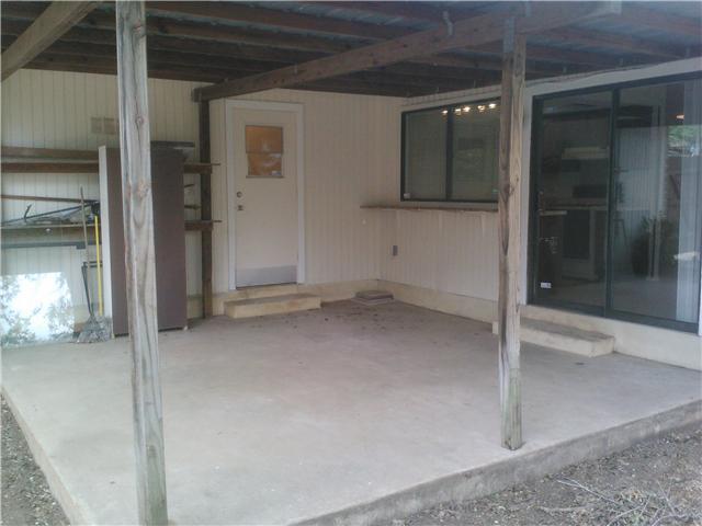 10612 Hard Rock Road Austin, TX 78750 - Photo 4 of 5 A spacious covered patio provides a versatile outdoor living area.