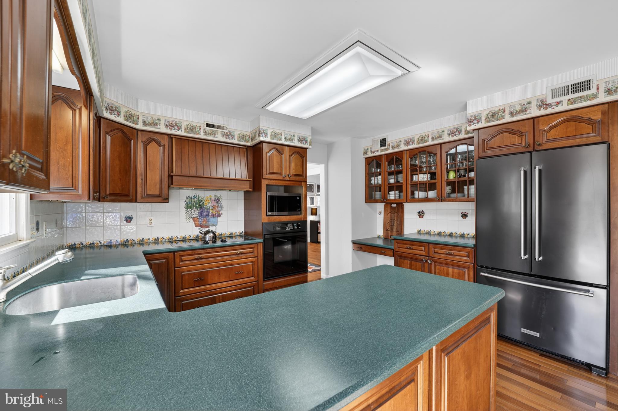 655 Santa Maria Lane Davidsonville, MD 21035 - Photo 11 of 54 a kitchen with stainless steel appliances granite countertop a refrigerator a sink dishwasher a stove and a sink with dishwasher