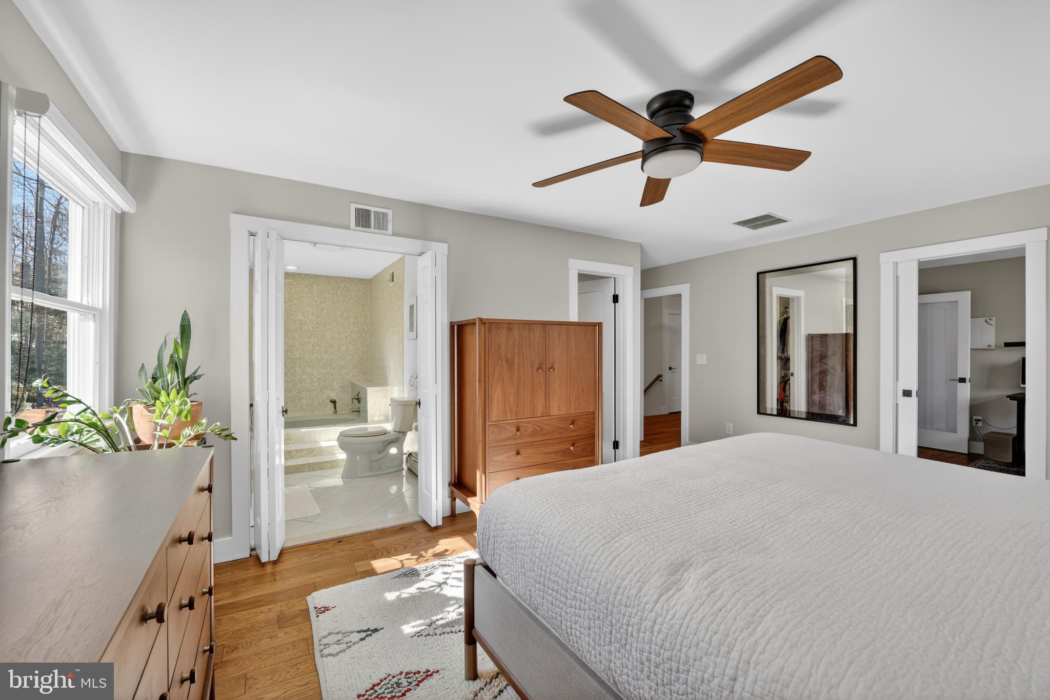 655 Santa Maria Lane Davidsonville, MD 21035 - Photo 16 of 54 a bedroom with a bed and a chandelier