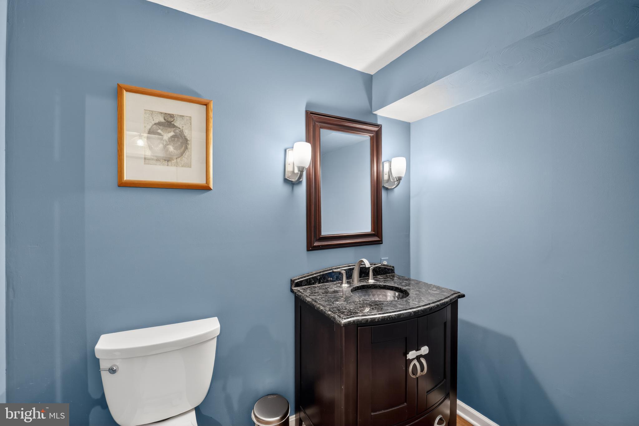655 Santa Maria Lane Davidsonville, MD 21035 - Photo 30 of 54 a bathroom with a toilet sink and mirror