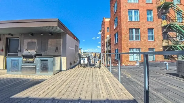 a view of a brick building with many windows