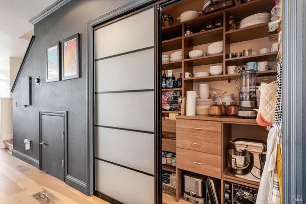 a kitchen with stainless steel appliances a refrigerator and a cabinets