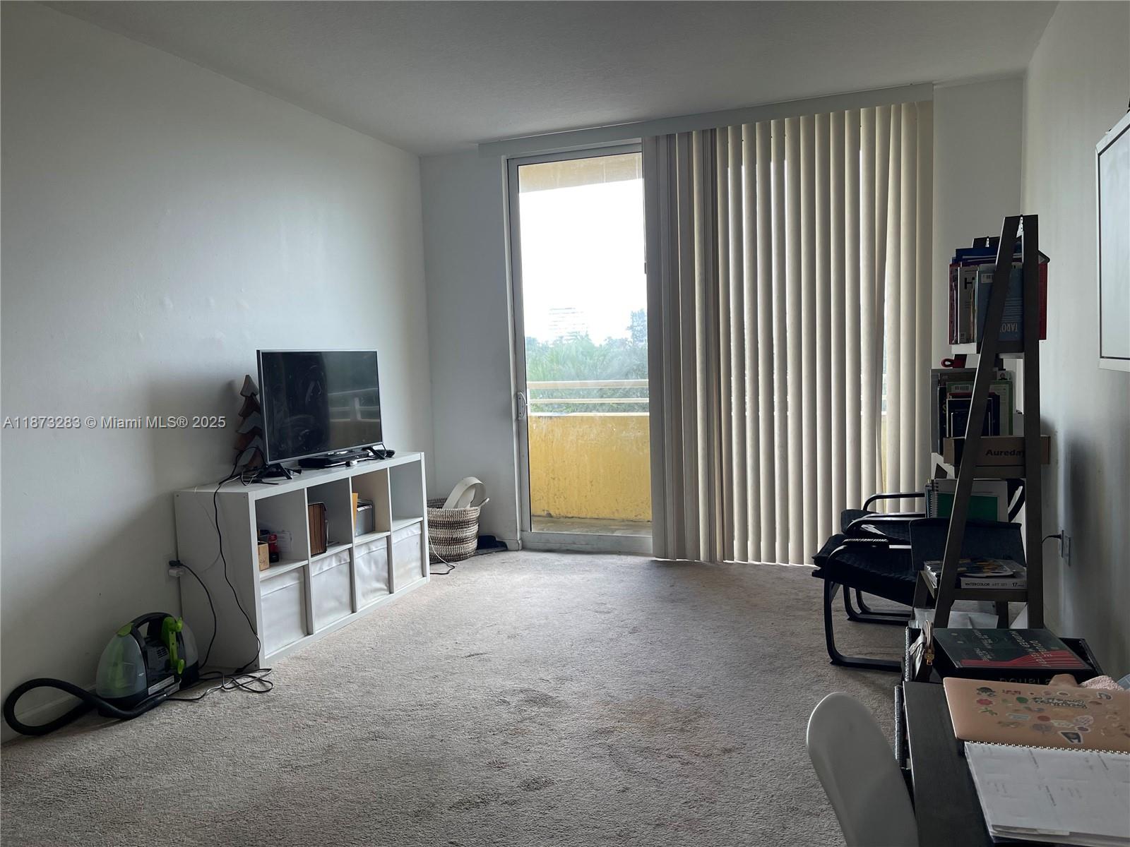 2775 Northeast 187th Street, Unit 205 Aventura, FL 33180 - Photo 13 of 53 a view of a livingroom with furniture and a window
