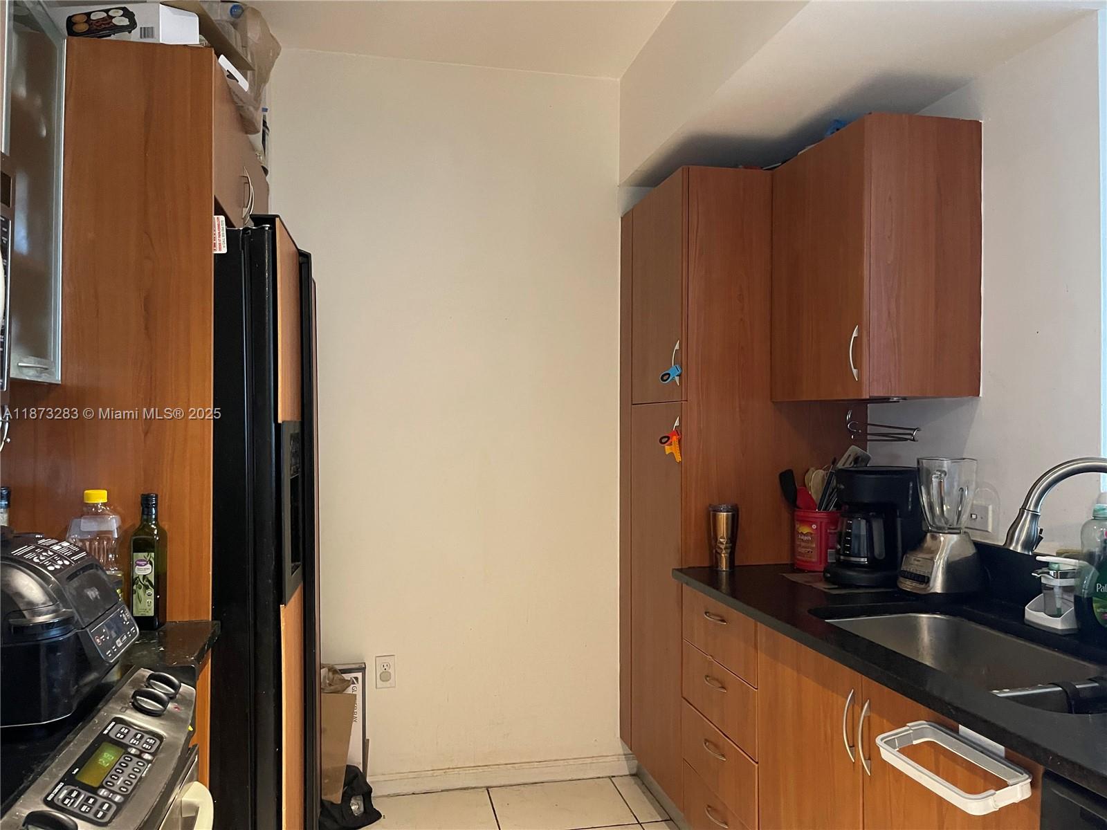 2775 Northeast 187th Street, Unit 205 Aventura, FL 33180 - Photo 2 of 53 a kitchen with sink and cabinets