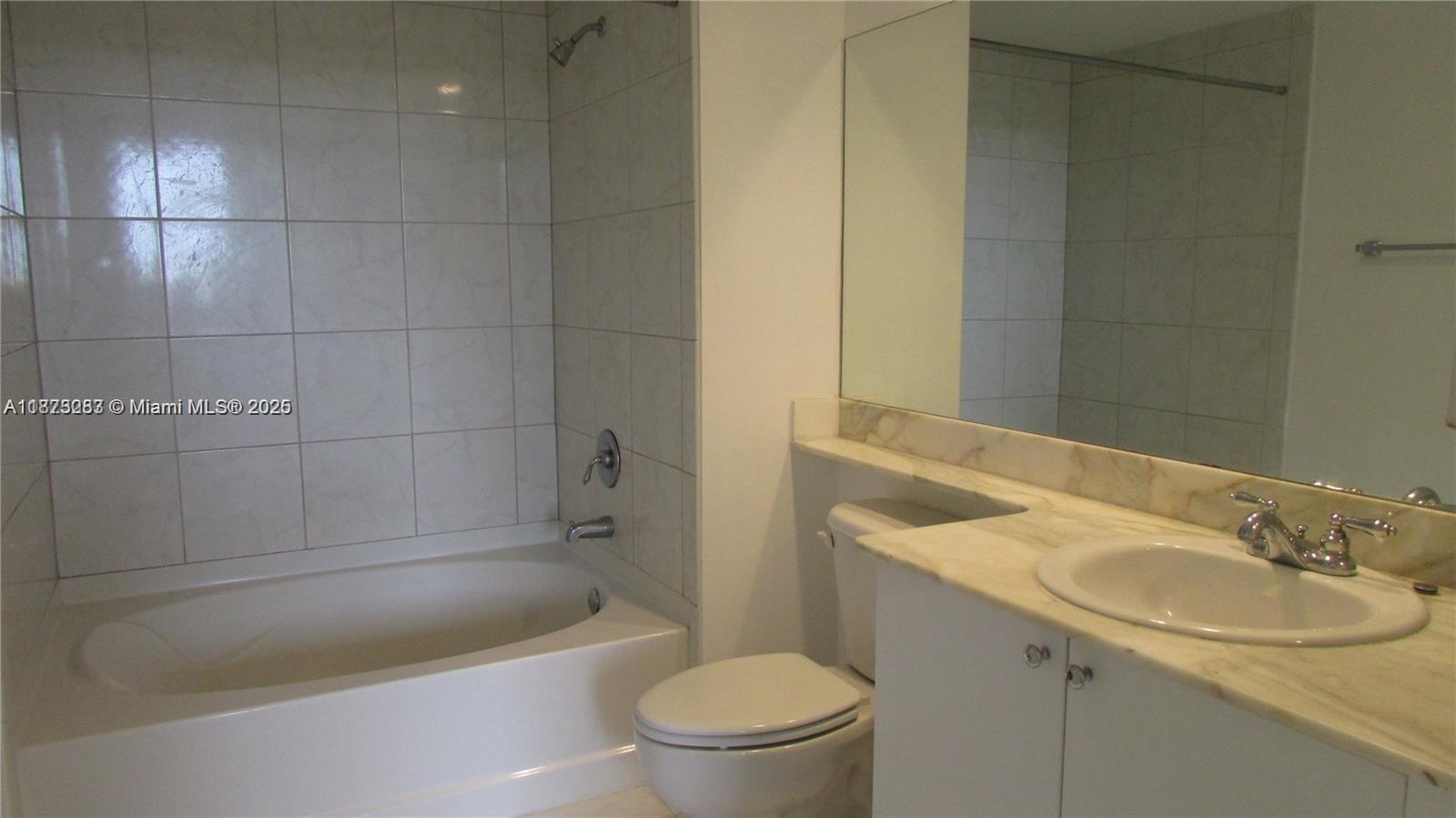 2775 Northeast 187th Street, Unit 205 Aventura, FL 33180 - Photo 24 of 53 a bathroom with a sink a toilet and bathtub