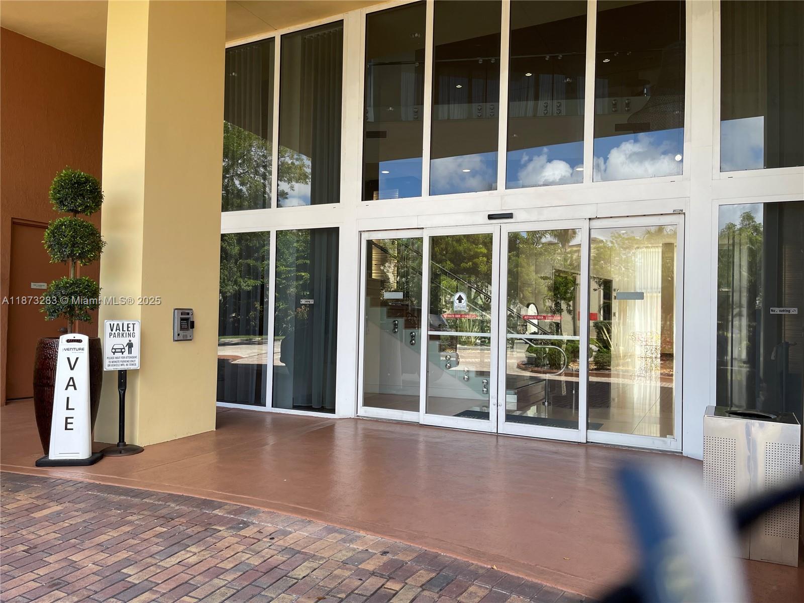 2775 Northeast 187th Street, Unit 205 Aventura, FL 33180 - Photo 29 of 53 a view of a building with a large window