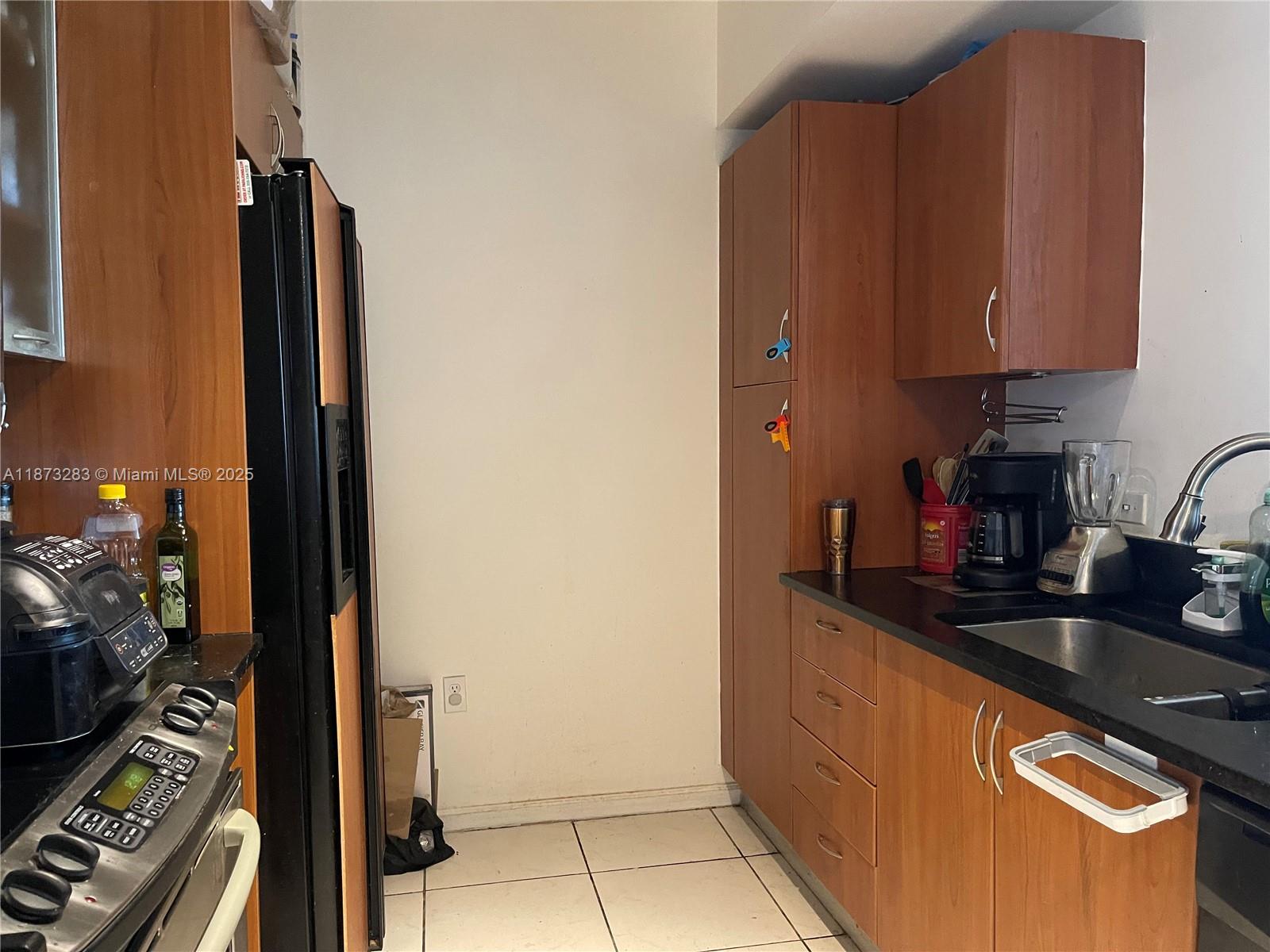 2775 Northeast 187th Street, Unit 205 Aventura, FL 33180 - Photo 3 of 53 a kitchen with sink and cabinets