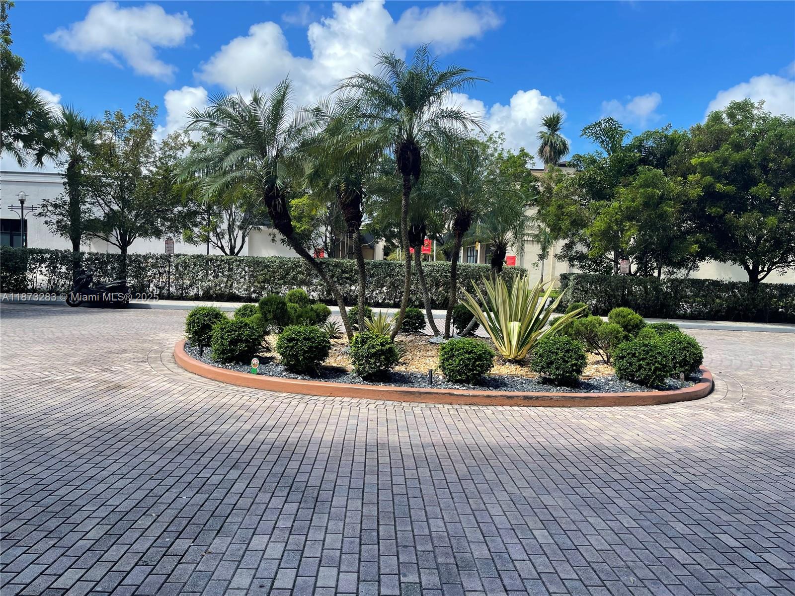 2775 Northeast 187th Street, Unit 205 Aventura, FL 33180 - Photo 31 of 53 a view of a house with a garden