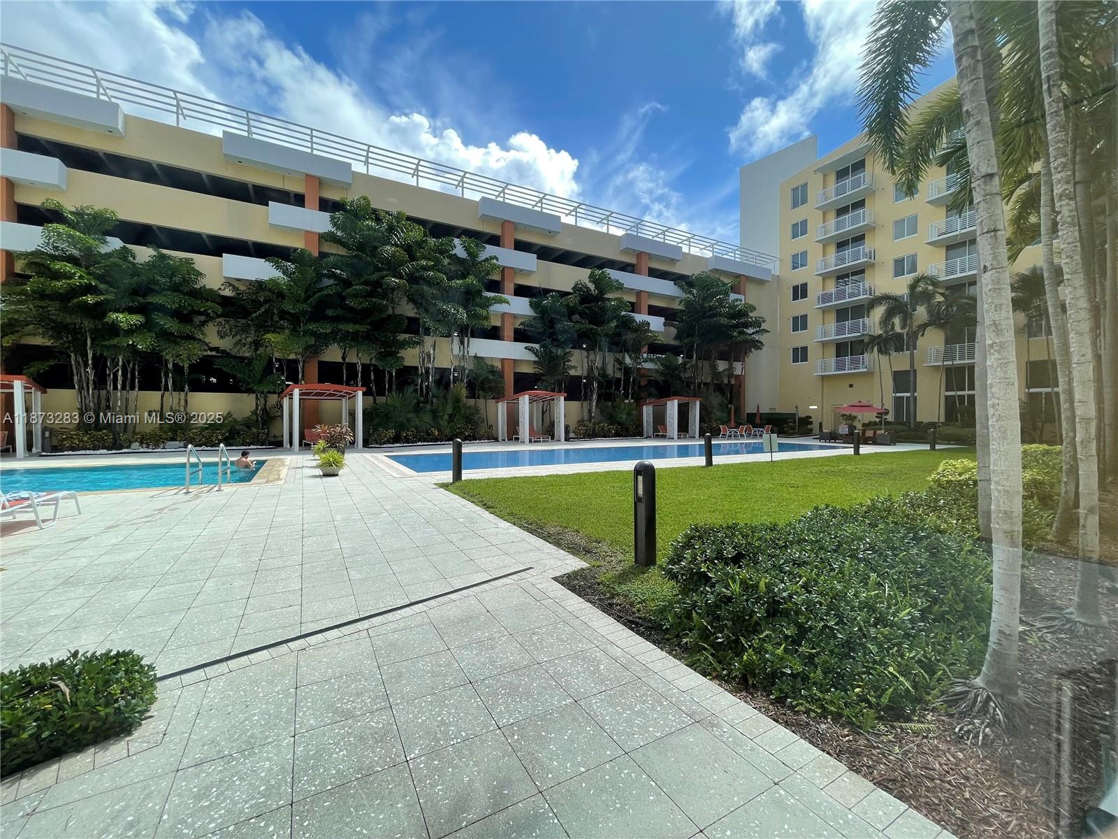 2775 Northeast 187th Street, Unit 205 Aventura, FL 33180 - Photo 33 of 53 a view of a building with a swimming pool