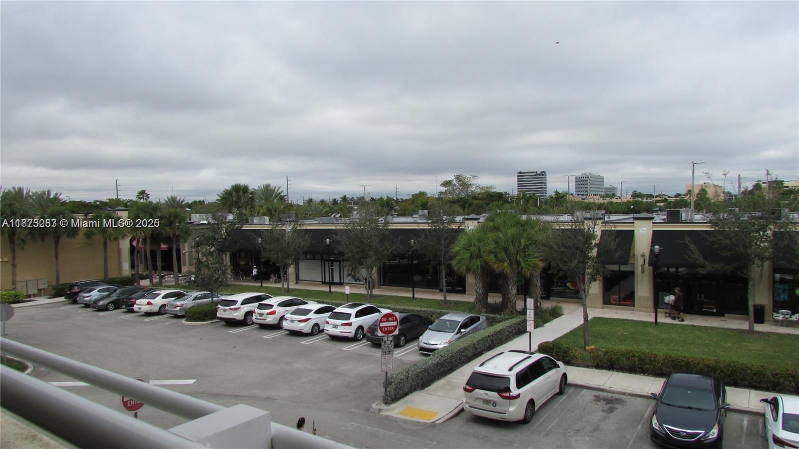 2775 Northeast 187th Street, Unit 205 Aventura, FL 33180 - Photo 35 of 53 a view of a parking space with cars park