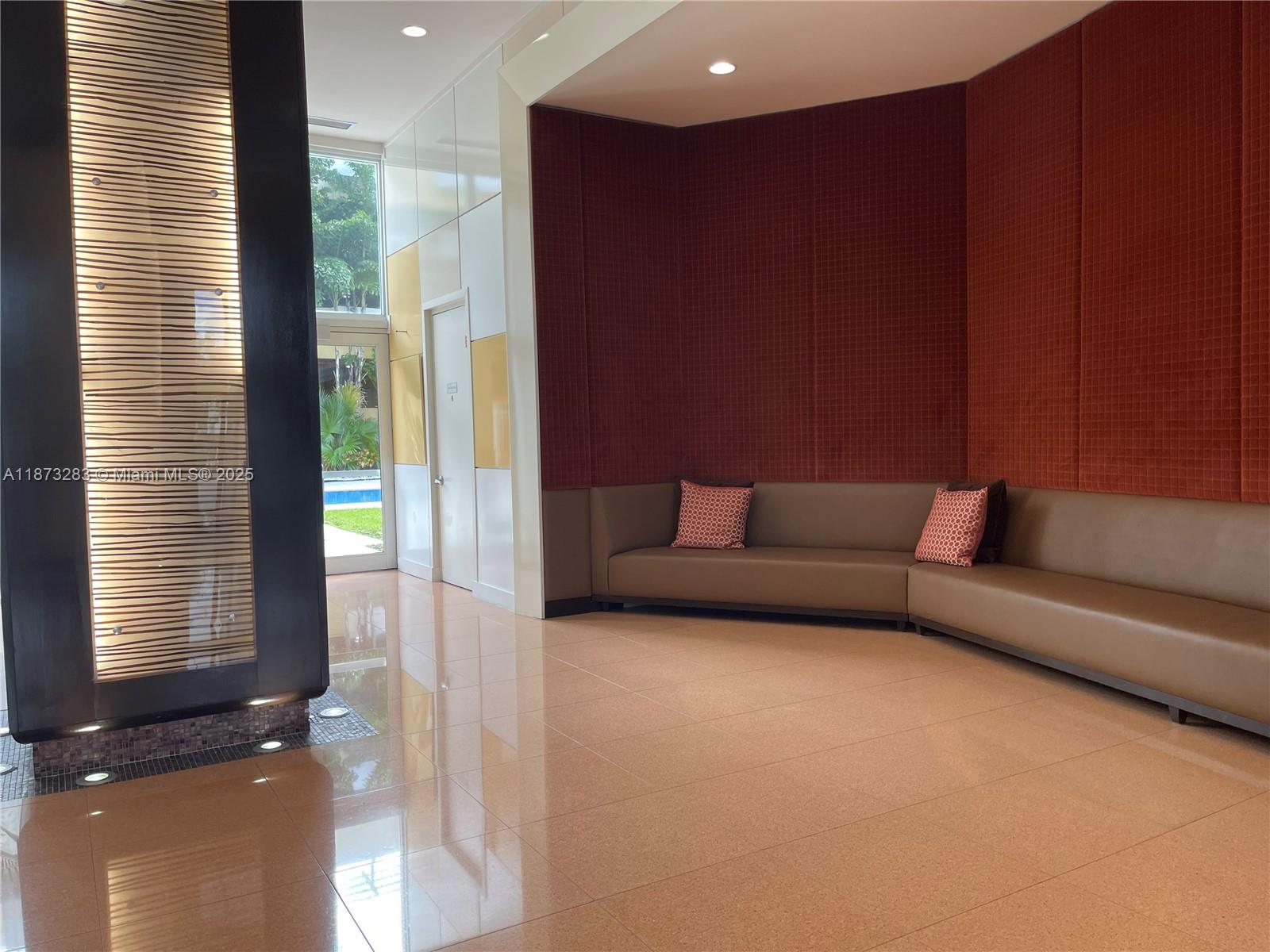 2775 Northeast 187th Street, Unit 205 Aventura, FL 33180 - Photo 38 of 53 a living room with furniture