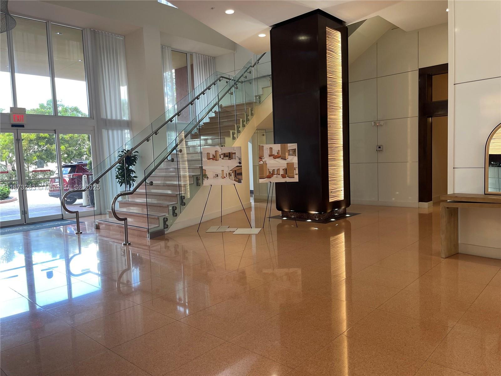 2775 Northeast 187th Street, Unit 205 Aventura, FL 33180 - Photo 39 of 53 a view of entryway and hall with wooden floor