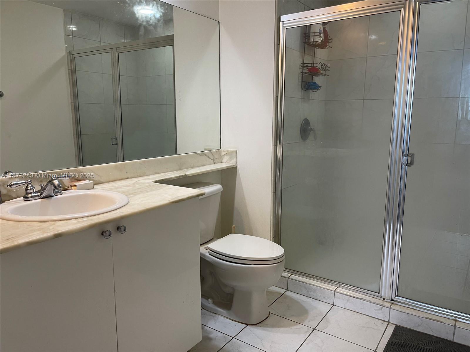 2775 Northeast 187th Street, Unit 205 Aventura, FL 33180 - Photo 4 of 53 a bathroom with a sink toilet and shower