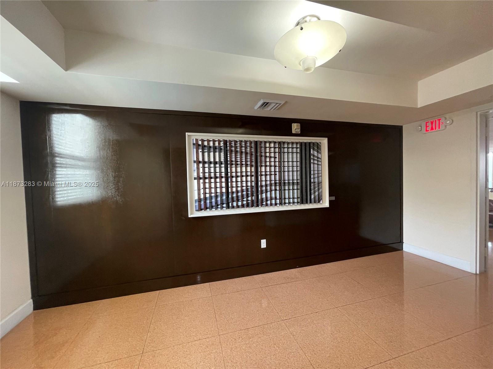 2775 Northeast 187th Street, Unit 205 Aventura, FL 33180 - Photo 41 of 53 a view of an empty room with a window