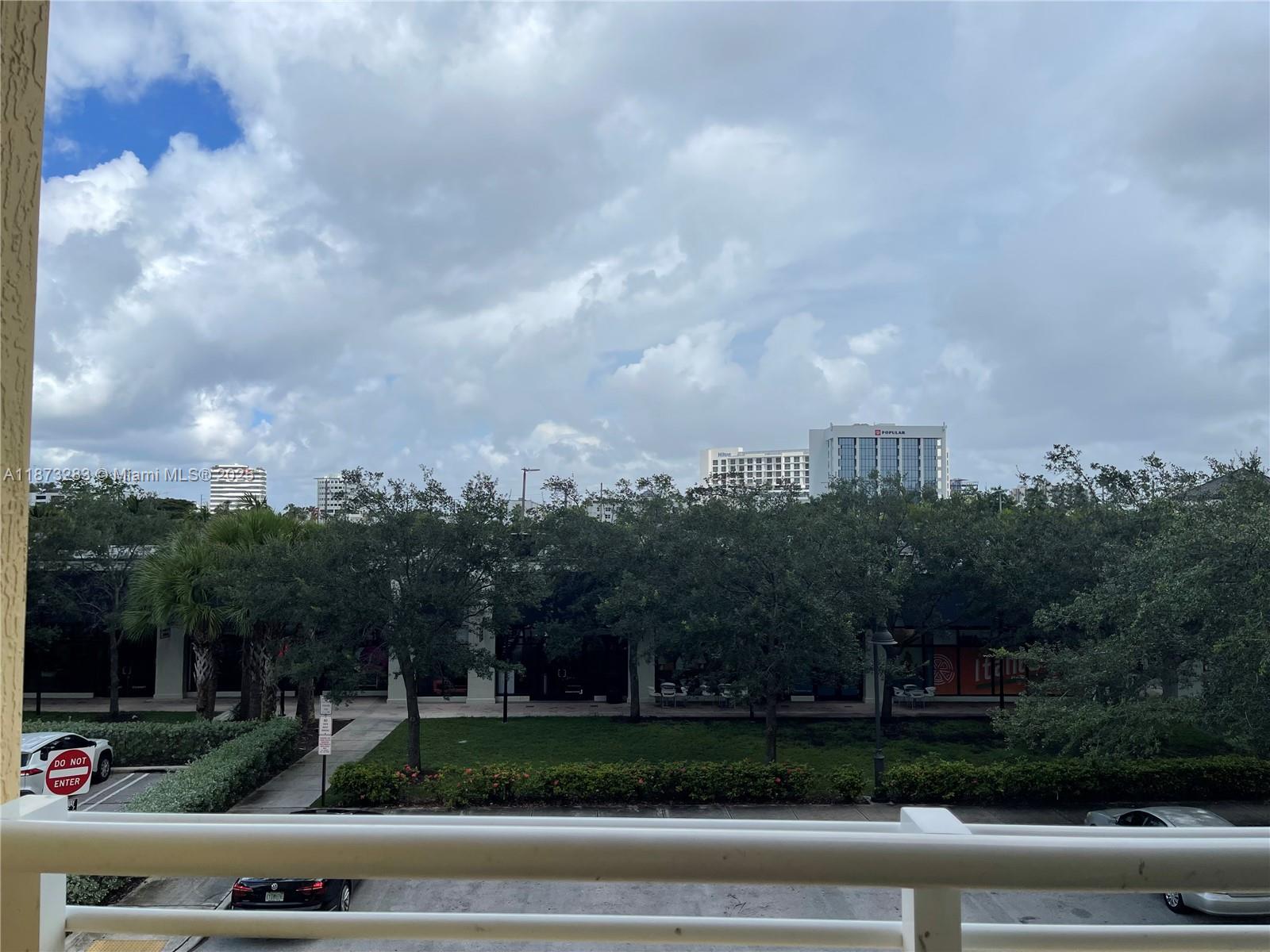 2775 Northeast 187th Street, Unit 205 Aventura, FL 33180 - Photo 47 of 53 a view of street with a yard in front of it