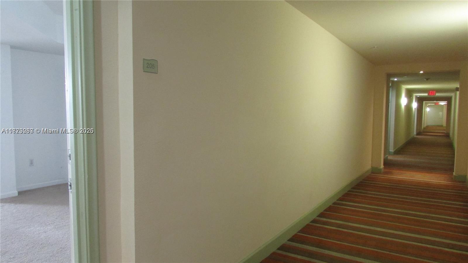 2775 Northeast 187th Street, Unit 205 Aventura, FL 33180 - Photo 53 of 53 a view of a hallway with wooden floor