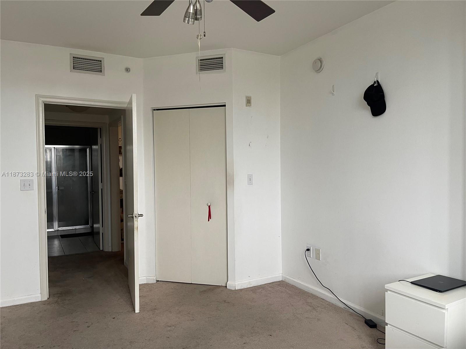 2775 Northeast 187th Street, Unit 205 Aventura, FL 33180 - Photo 7 of 53 an empty room with a empty space and a ceiling fan