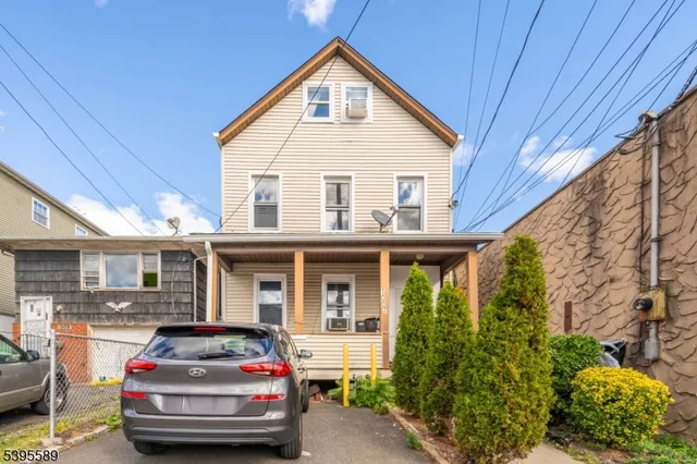 a car parked in front of a house
