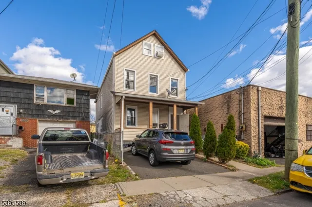 a car parked in front of a house