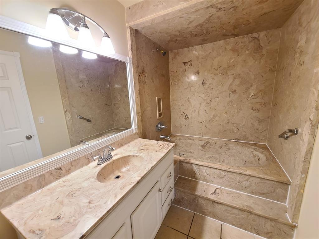 2 Crossings Circle, Unit G Boynton Beach, FL 33435 - Photo 11 of 22 a bathroom with a sink vanity granite tub and shower